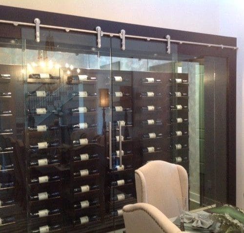 Dorma Manet Sliding Doors and Wall Seperating the Wine Room and Dining Room | Glass Wall Systems Gallery | Interior Glass Products | Anchor-Ventana Glass